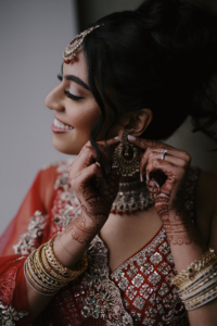 Shifali and Vikram Wedding - Bride Putting on Jewelry - Vesper - Tati and Roman Photography