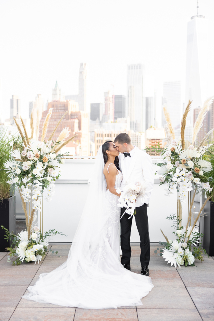 Joye and Scott Wedding - Bride and Groom Kissing Bouquet Altar Arrangements - Tribeca Rooftop - Rafal Ostrowski Photography